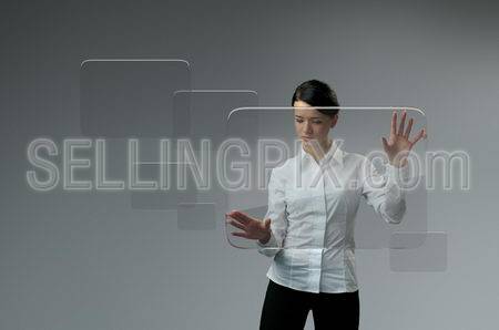 Future technology touchscreen interface. Girl touching transparent screen interface.  Business lady pressing virtual  copyspace button .