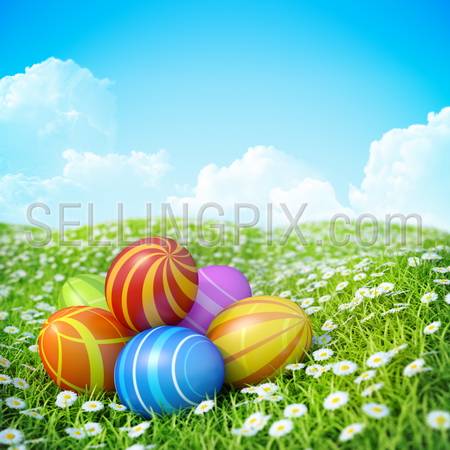 Easter Greeting Card with decorated Easter eggs in the grass with flowers. Background with ornate Easter eggs on meadow.