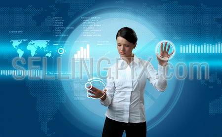Attractive brunette navigating futuristic interface (outstanding business people in interiors / interfaces series)