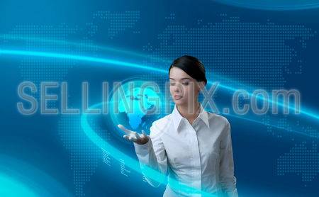 Attractive brunette holding virtual globe (outstanding business people in interiors / interfaces series)