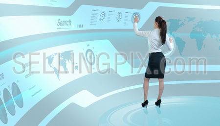 Brunette operating search interface on the wall (Attractive young adults in futuristic interfaces / interiors series)