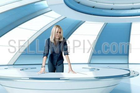 Sexy blonde boss in future interior office room. Leans on the oval futuristic table. Future collection.