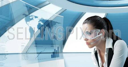 Sexy latina brunette in future glasses and headset. Looking at the transparent screen with interface. Pretty young business people in interiors / interfaces series.